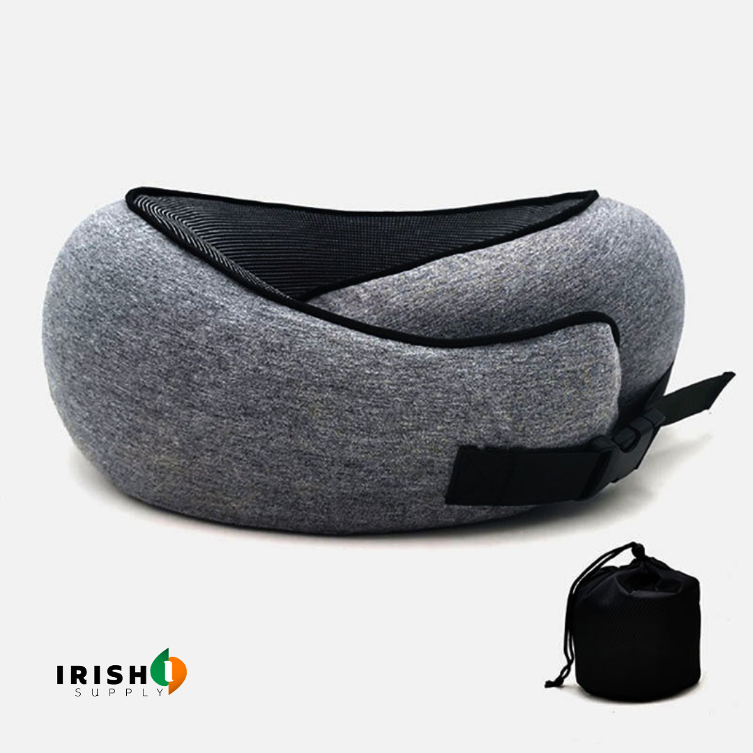 Grey pillow with black mesh lining and fastened black buckle strap, shown with its small black drawstring pouch. 10