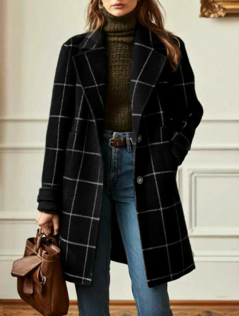 Model wears the black coat with white check lines, left open over a polo neck and jeans 11
