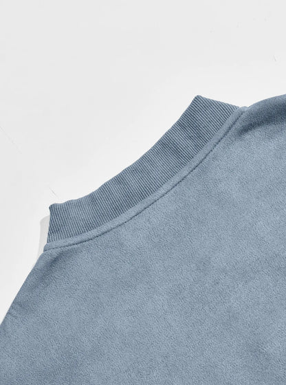 Back of the light blue jacket showing the ribbed collar and smooth shoulder panel 11
