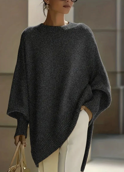 Dark grey marl jumper with ribbed cuffs and hem, styled with cream trousers and a light handbag 12