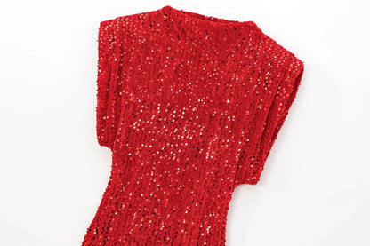 Top half of the red sequinned dress laid flat, showing the neckline and padded shoulders 12