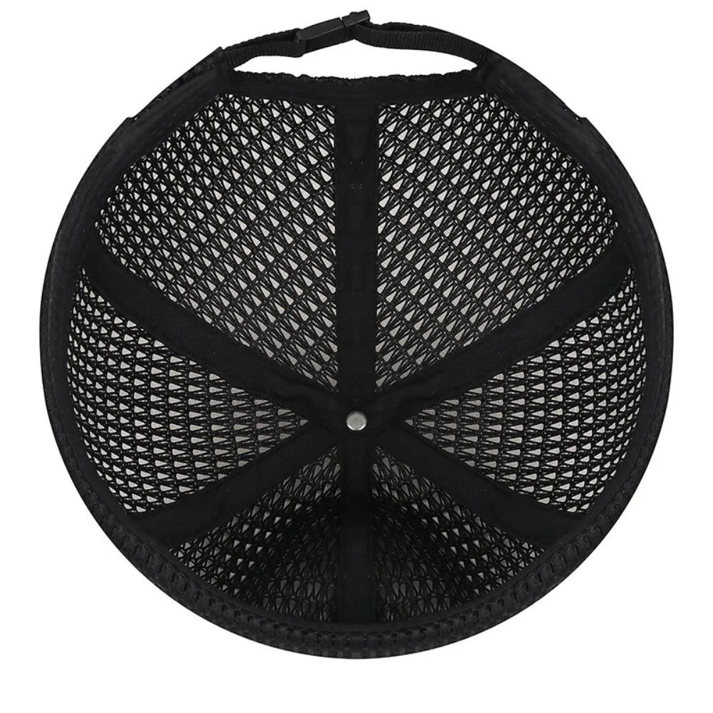 Inside view of the black cap showing the mesh panels, seams, centre rivet and buckle strap 12