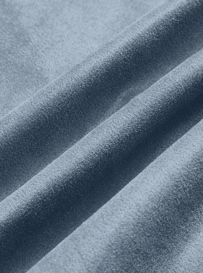 Close-up of soft light blue suede-look fabric folded into gentle ridges 12