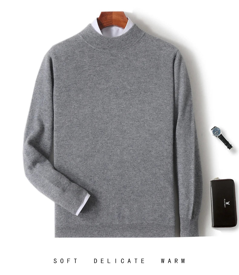 Mid grey mock neck jumper hung up with a white shirt collar, watch and black wallet 12