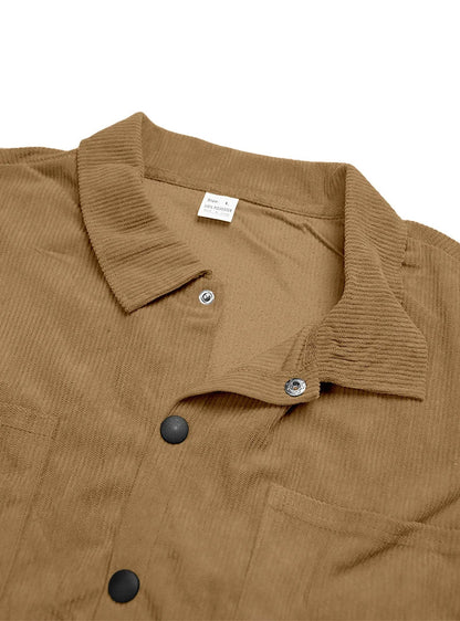 Flat view of the tan shirt's collar and inner neck label with metal snap fastening 13