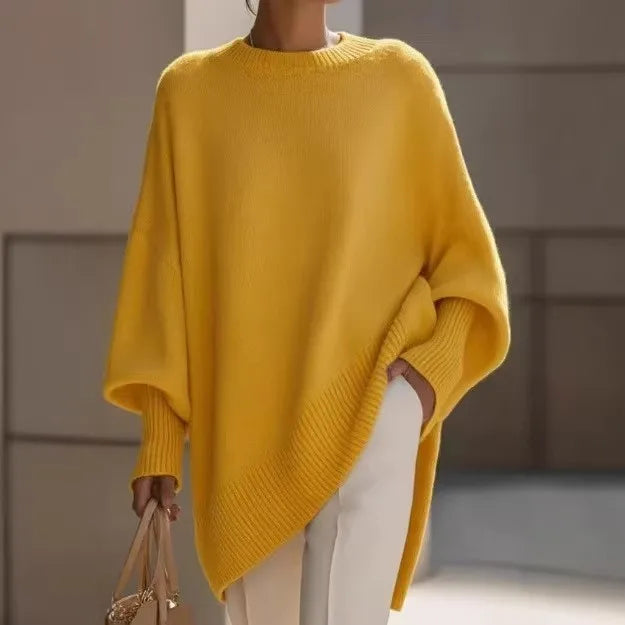 Yellow jumper worn outdoors, hand in the trouser pocket and a beige handbag in the other hand 13