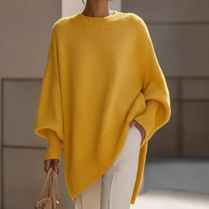 Yellow jumper worn outdoors, hand in the trouser pocket and a beige handbag in the other hand 13