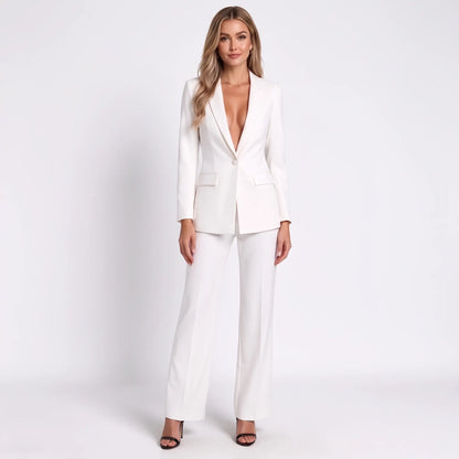 White suit on a blonde model in strappy heels, full-length front view showing the plunging lapel neckline 13