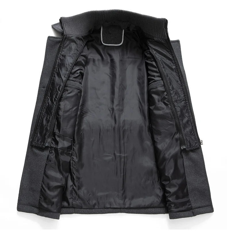 Inside of the grey overcoat opened out, showing the black lining and the zipped inner layer 14