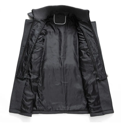 Inside of the grey overcoat opened out, showing the black lining and the zipped inner layer 14