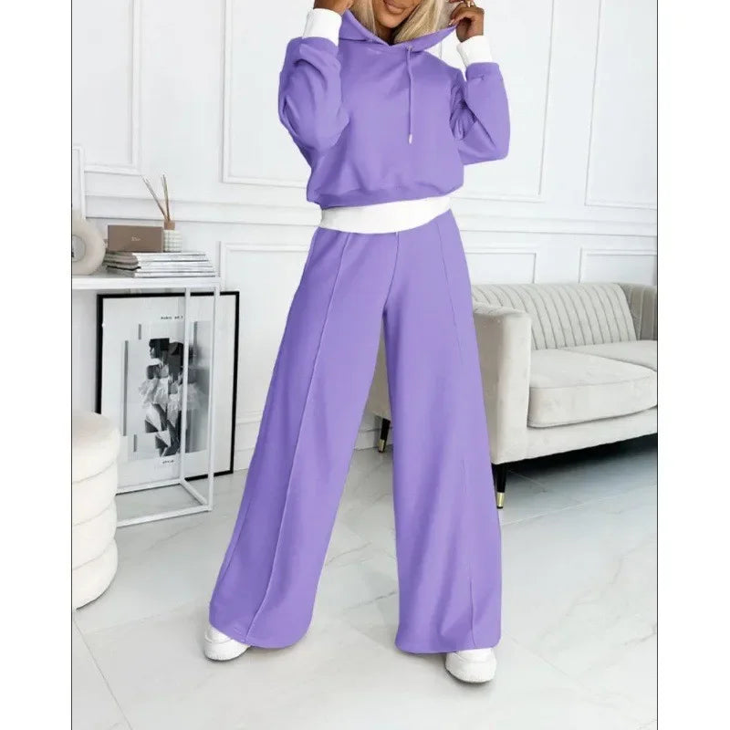 Lilac hooded set with white trim, full-length view with model's hands at the hood 14