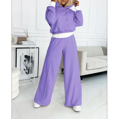 Lilac hooded set with white trim, full-length view with model's hands at the hood 14