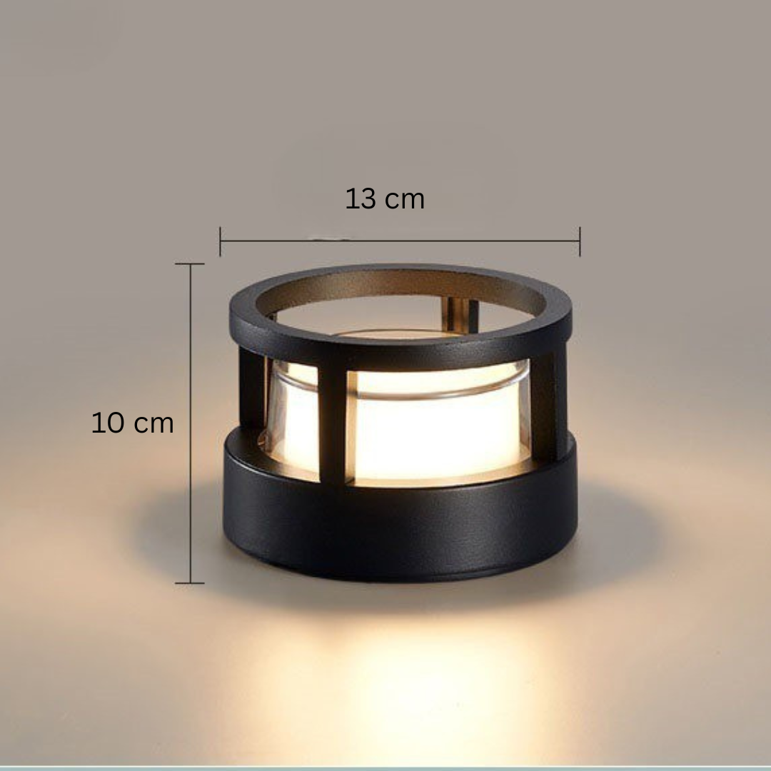 Round open-ring light with dimension lines marking its width and height, glowing on a neutral background. 13