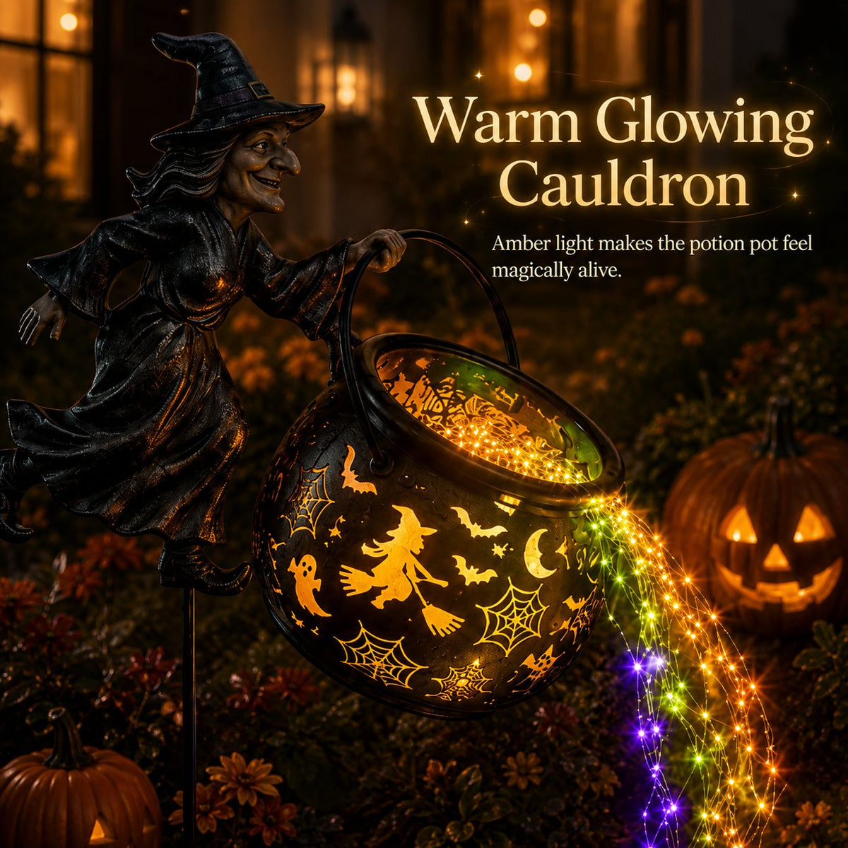 Close-up of the tilted cauldron glowing amber through its witch, bat, ghost and cobweb cut-outs, beside a carved pumpkin. 5