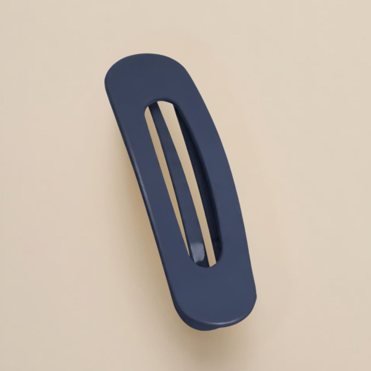 Matte navy slim flat clip with a long open slot on a beige background 15