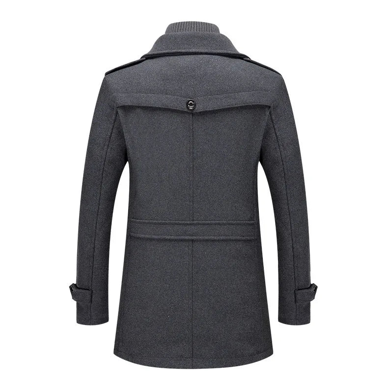 Back view of the grey overcoat, with the buttoned yoke flap, waist strap and shoulder epaulettes 15