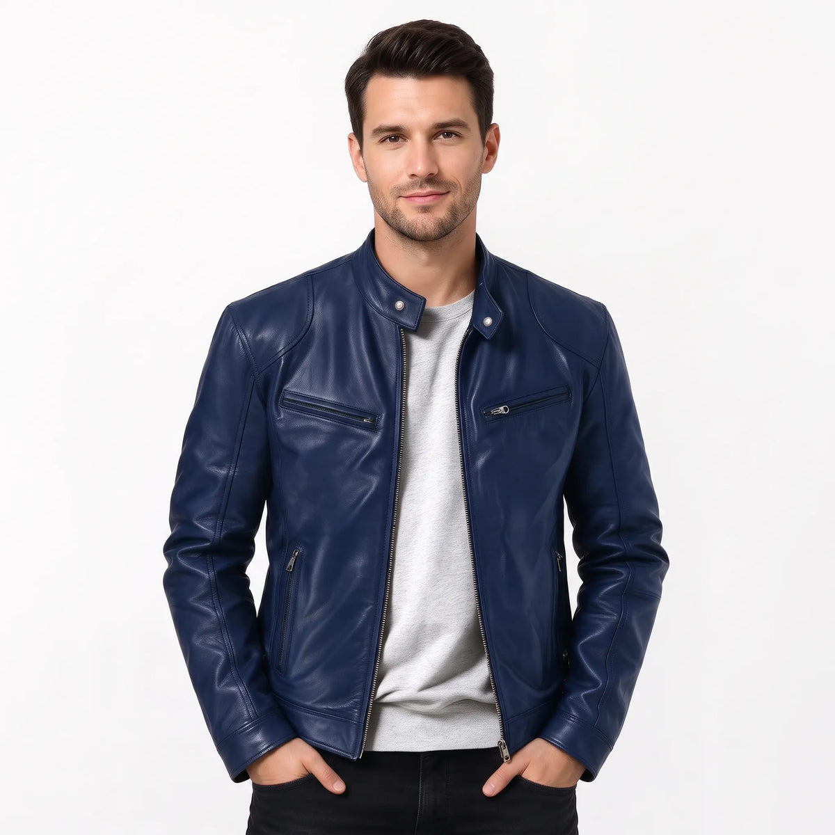 Model in a navy leather biker jacket over a grey t-shirt, hands in pockets 15