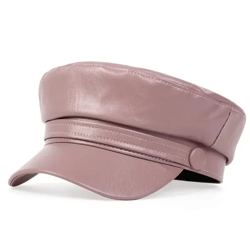 Dusty pink baker boy hat in soft faux leather, three-quarter view with matching stitching and button 15