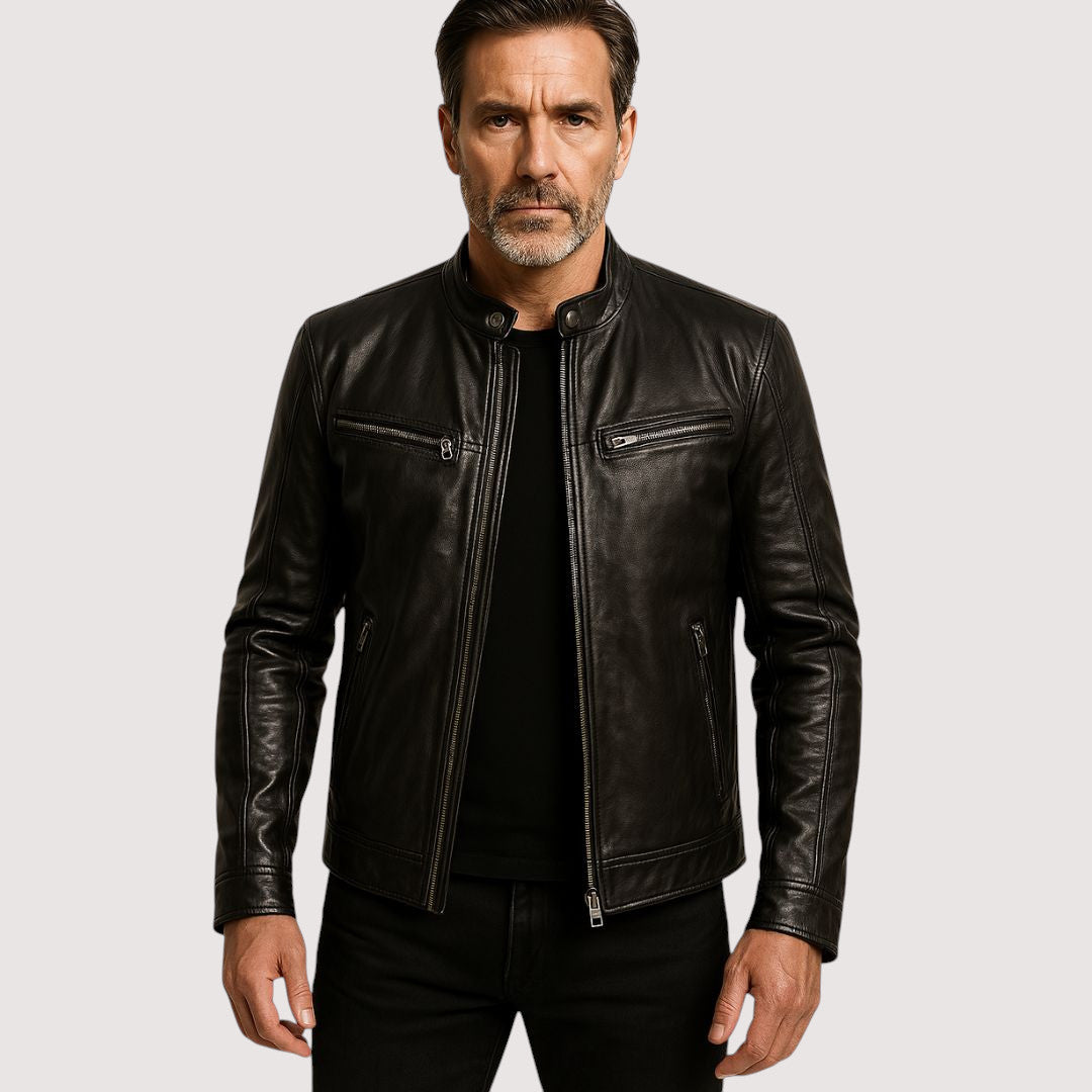 Grey-bearded man wearing the black leather biker jacket, unzipped over a black t-shirt and jeans 1