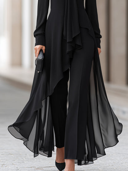Lower half of the outfit showing the sheer chiffon tunic hem flowing over black wide-leg trousers and black pointed heels. 4