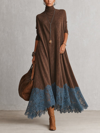 Model in the brown suede-look turtleneck maxi dress with blue lace hem, holding a tote bag, front view 1