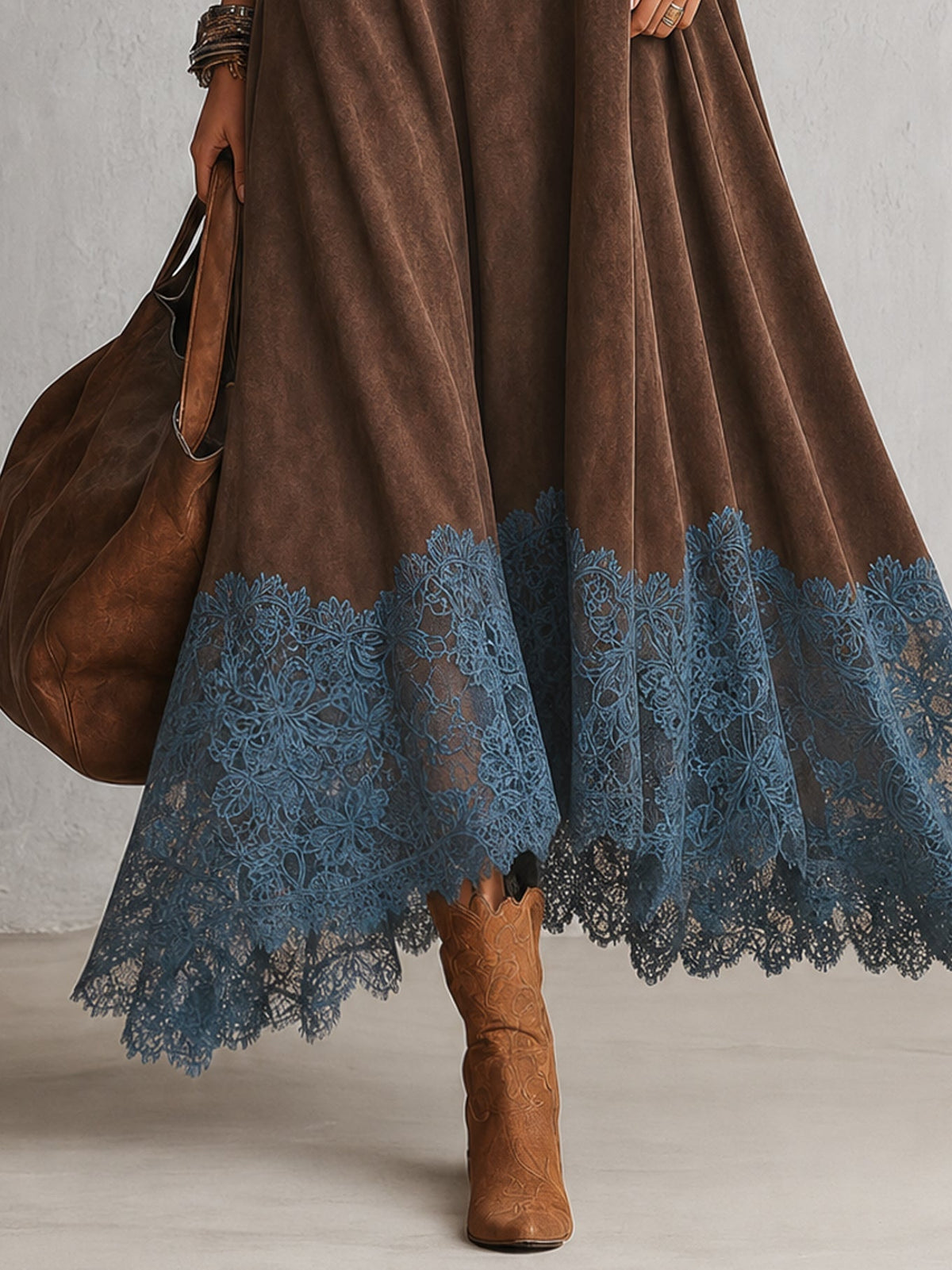 Close-up of the blue floral lace hem on the brown dress, with tan boots 8