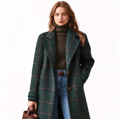 Model on a white background wears the dark green coat with pink check lines, button cuffs and jeans 17