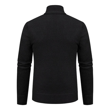 Back view of the black knitted cardigan, showing the plain textured knit and ribbed collar 17