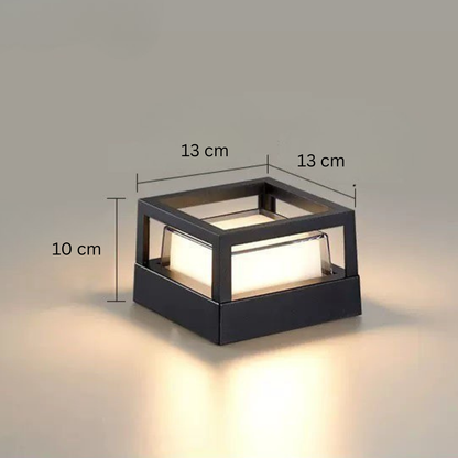 Square open-frame light with dimension lines marking its width, depth and height, glowing on a neutral background. 15