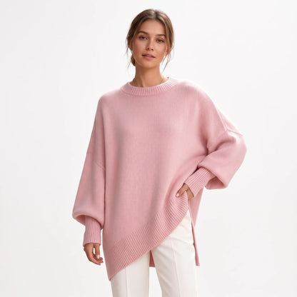 Studio shot of the pink jumper with ribbed neck and cuffs, paired with white trousers 17
