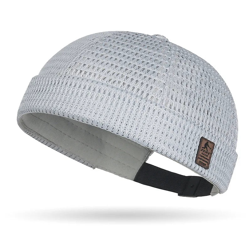 Light grey open weave brimless cap showing the mesh texture and adjustable strap 18