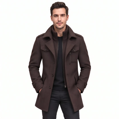 Man wearing the dark brown coat open over a black jumper and black trousers 18