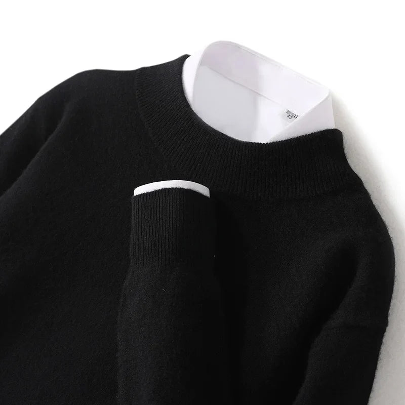 Close-up of the black jumper's ribbed mock neck and cuff, with white shirt underneath 18