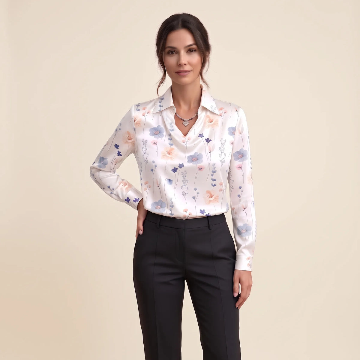 Model in a white satin blouse with pastel wildflower print, black trousers and a heart pendant 19