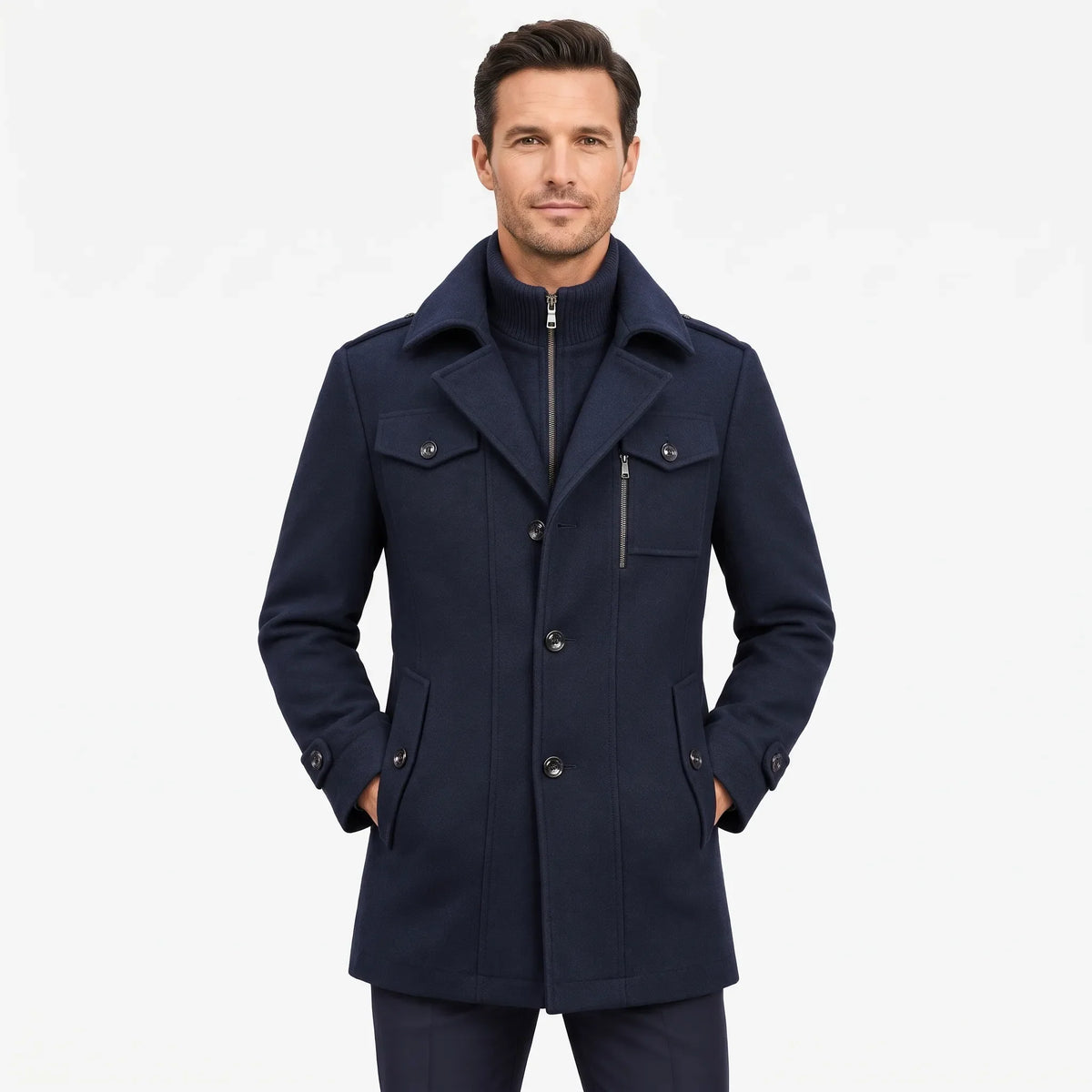 Man wearing the navy overcoat facing the camera, hands in pockets, zip-up ribbed collar layered underneath 19