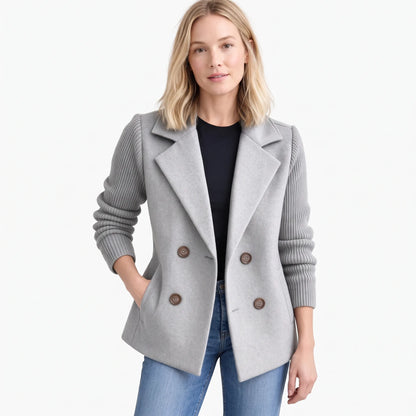 Studio shot of model in light grey double-breasted jacket with ribbed sleeves and wide lapels 19