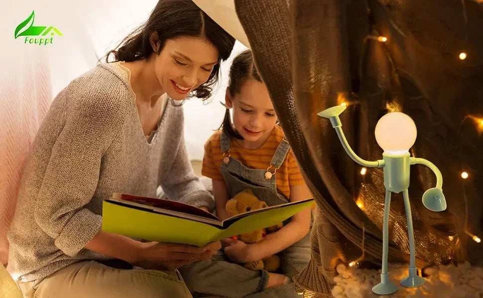 Mother and daughter reading a picture book in a cosy den, with a green figure light glowing nearby 19