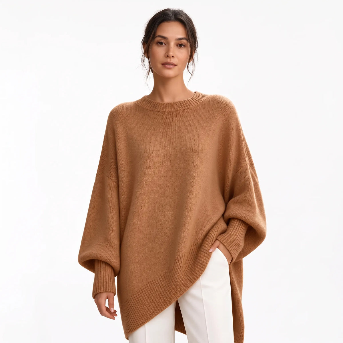 Studio shot of the camel-brown jumper with ribbed trims, worn with white trousers on a plain background 19