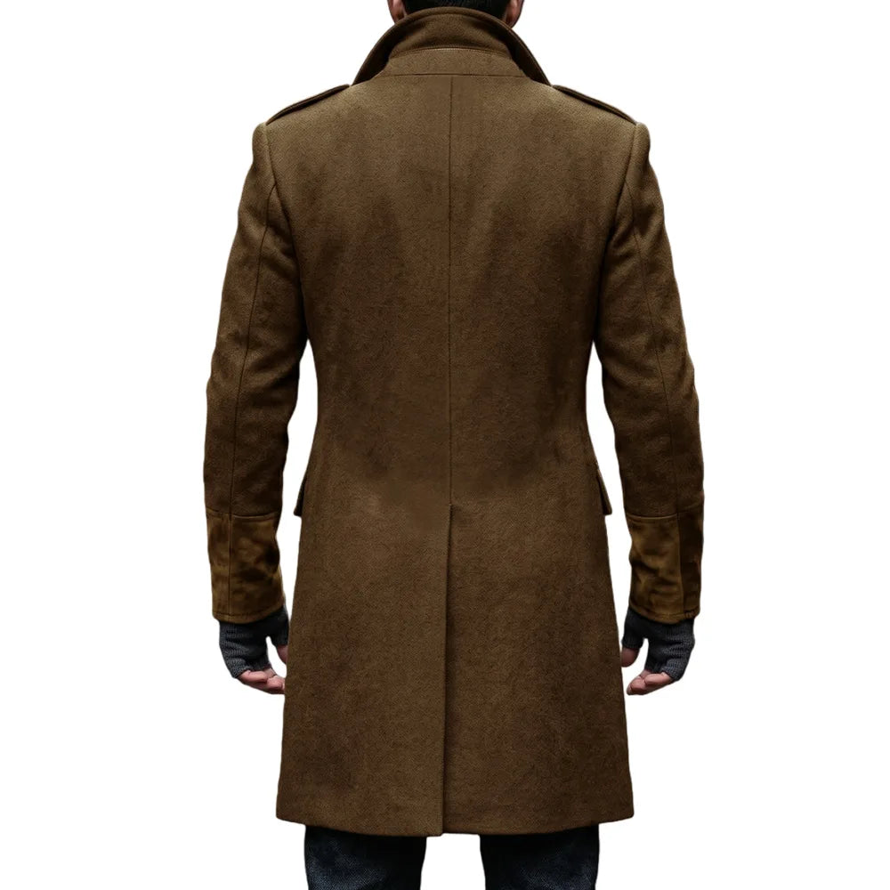 Back view of the brown overcoat on a model, showing the centre back vent and suede-look cuffs 19
