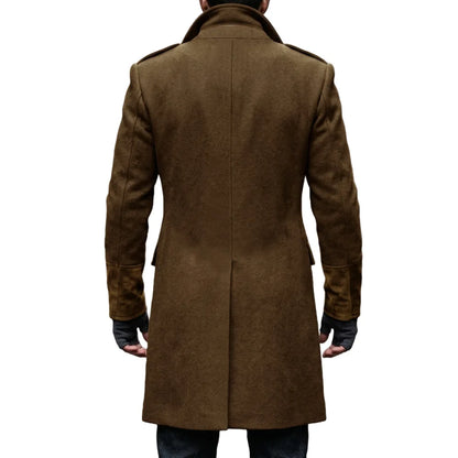 Back view of the brown overcoat on a model, showing the centre back vent and suede-look cuffs 19