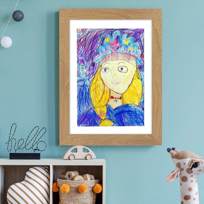 Oak-effect frame on a teal wall above a small shelf, displaying a child's crayon portrait of a girl in a crown. 15