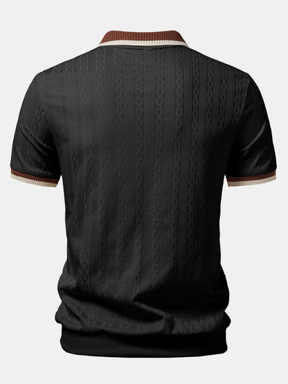 Back view of the black polo showing the vertical cable texture, striped collar edge and sleeve cuffs. 4