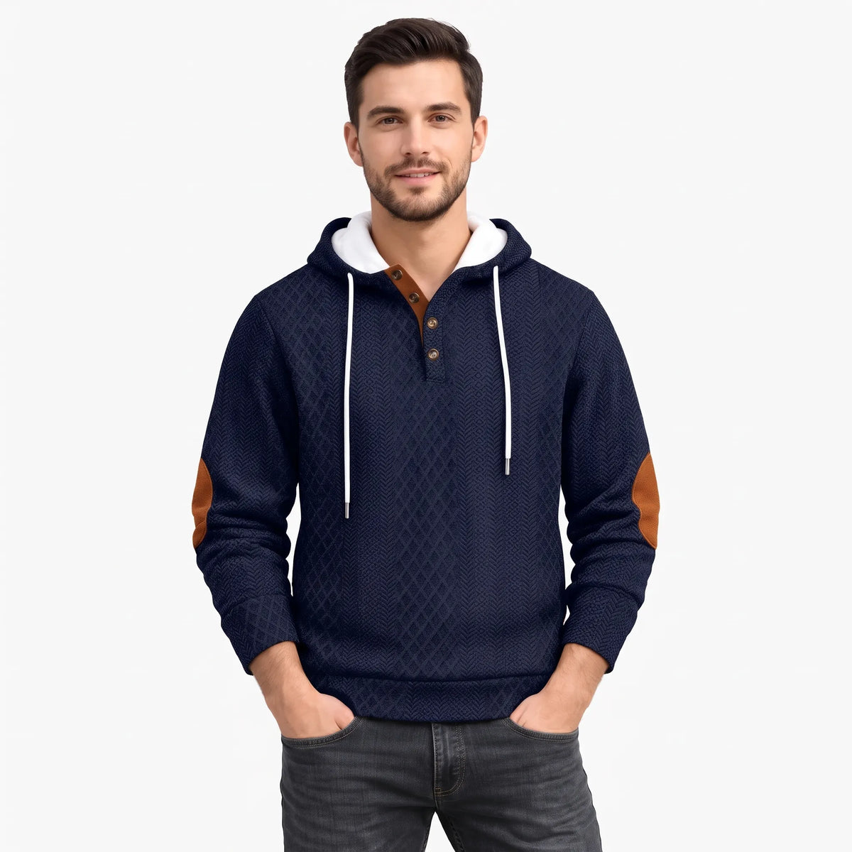 Model facing forward in a navy diamond-textured hoodie with button placket, white drawstrings and tan elbow patches, hands in 1