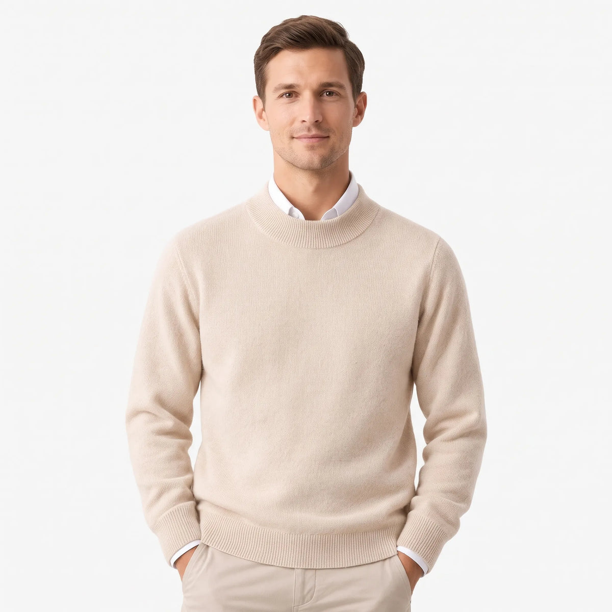 Man wearing the cream mock neck jumper over a white collared shirt with beige trousers 1