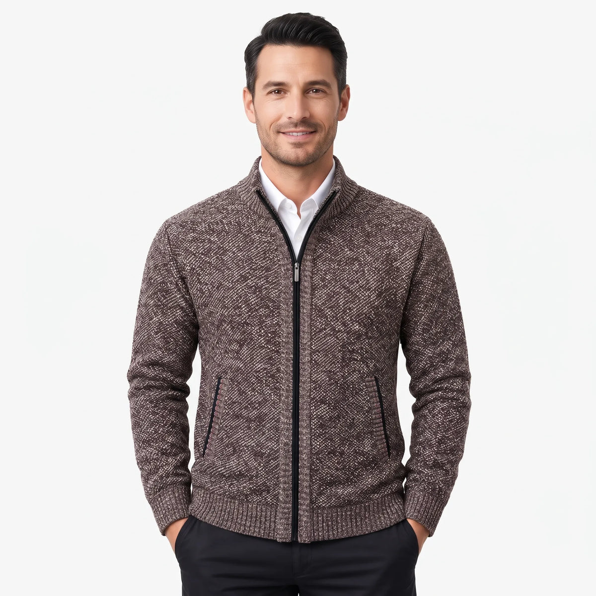Smiling man models the brown flecked zip cardigan over a white shirt, hands in black trouser pockets 1