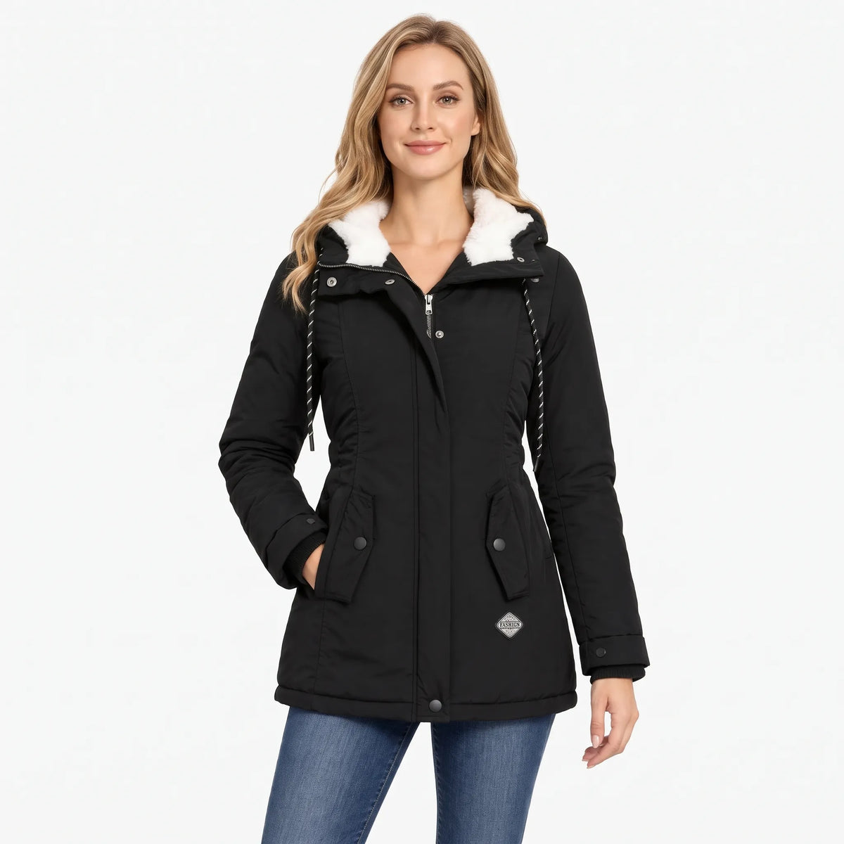 Smiling model wears the black hooded jacket with cream fleece lining, flap pockets and drawcord hood, with jeans 1