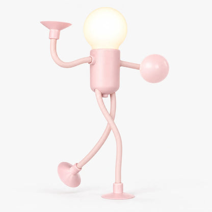 Pink posable figure night light with glowing round bulb head, bendy arms and legs, standing on suction feet 1