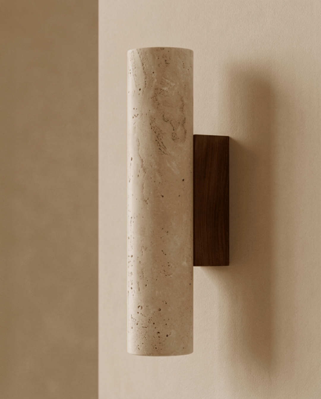 Side view of the cylindrical travertine wall light on its dark wooden wall bracket, unlit 1