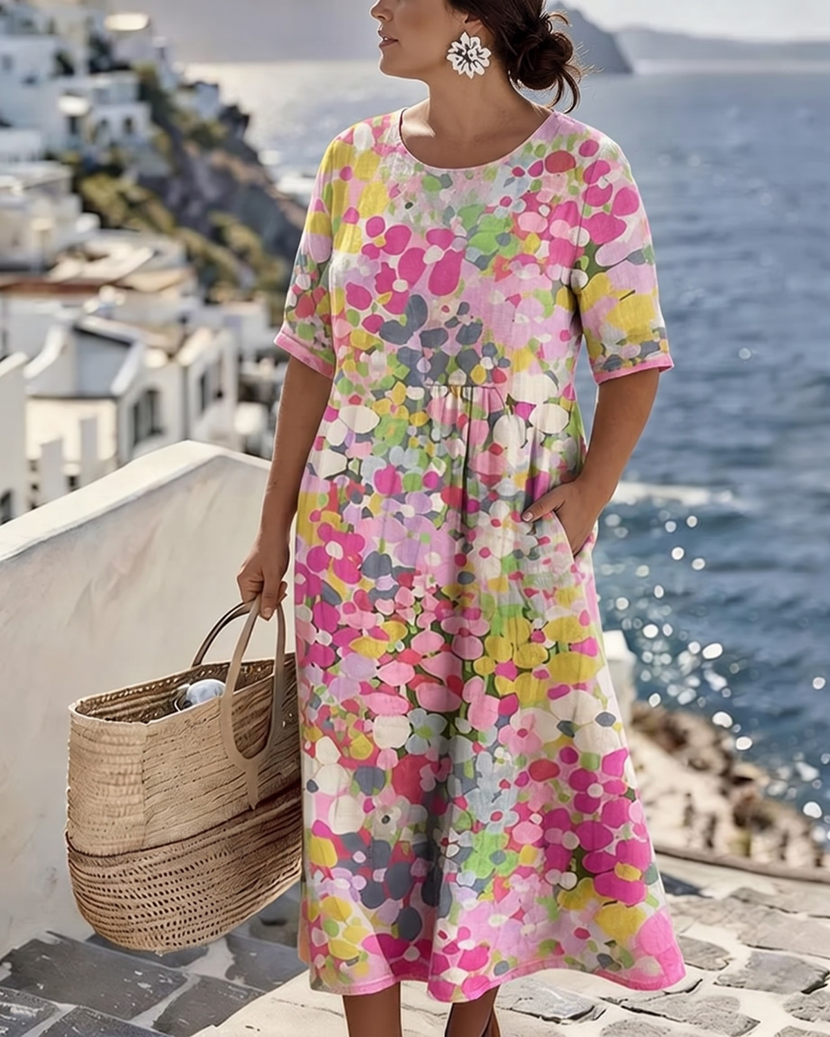 Close three-quarter view of the pink floral dress, hand in pocket, seaside steps behind 2