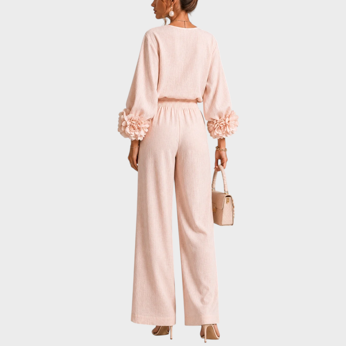Back view of the blush pink set, showing the gathered waistband and flowers on both cuffs 8